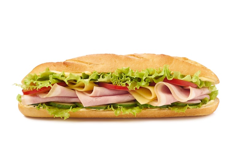 Delicious baguette sandwich with ham and cheese