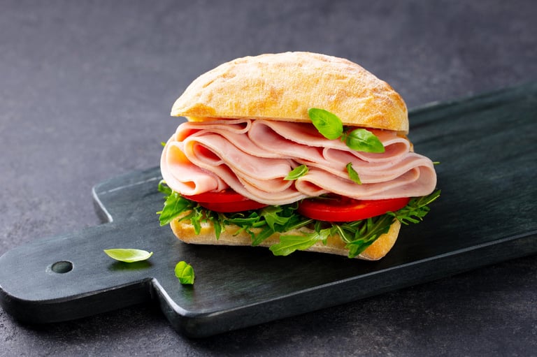 Ciabatta sandwich with ham and fresh tomatoes