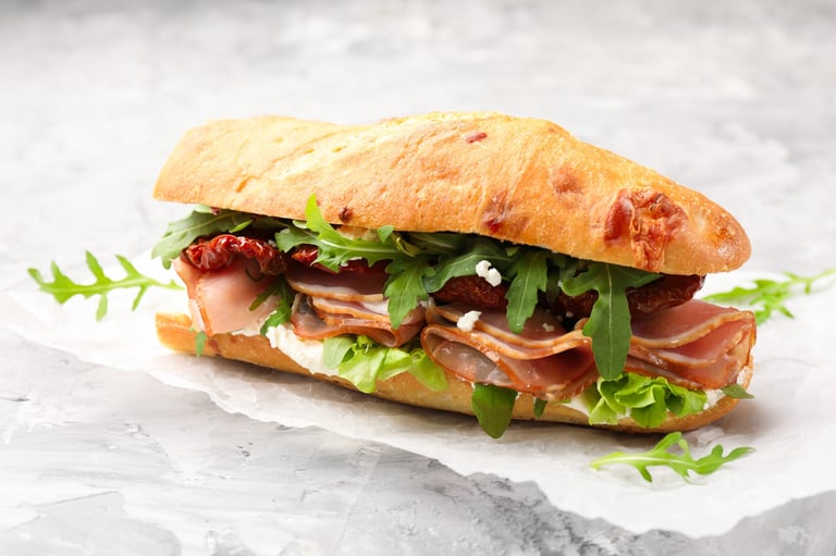 Baguette sandwich with ham and sun dried tomatoes